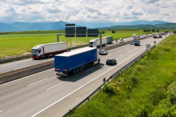 car-trucks-rushing-multiple-lane-highway-turin-bypass-italy-_107467-361